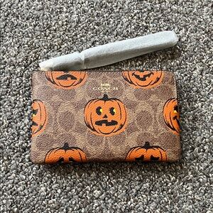 Coach pumpkin wristlet